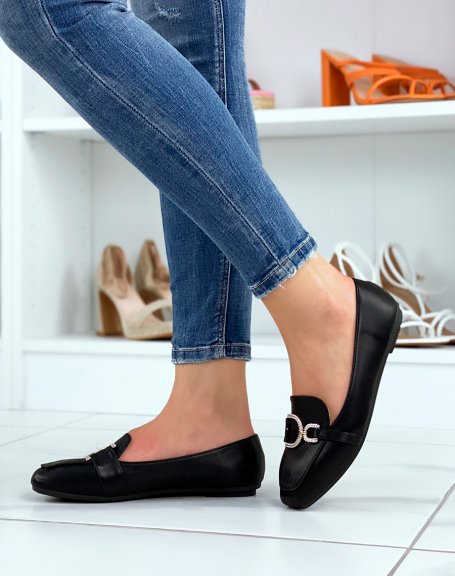 Black loafers with asymmetrical golden rhinestone buckles