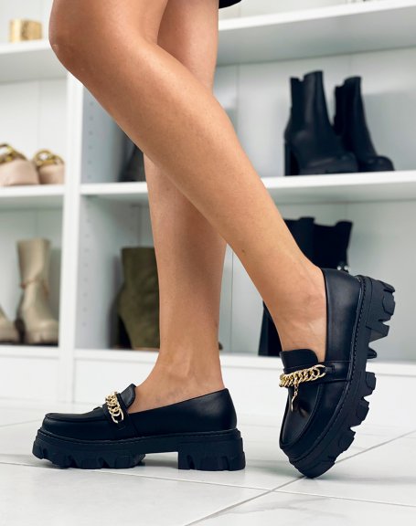 Black loafers with chain and gold jewel and notched sole