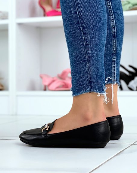 Black loafers with golden buckles and rhinestones
