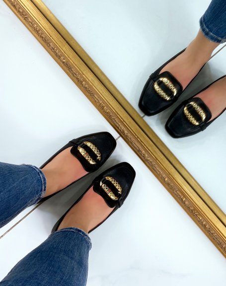 Black loafers with large imposing golden buckle