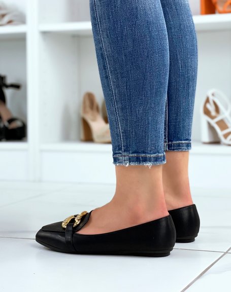 Black loafers with large imposing golden buckle
