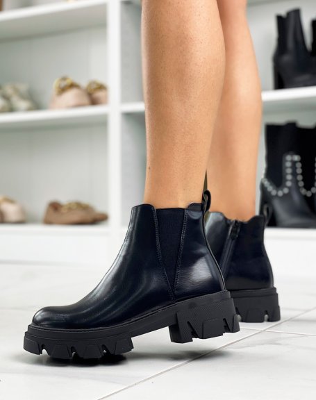 Black low-cut ankle boots with chunky lug soles