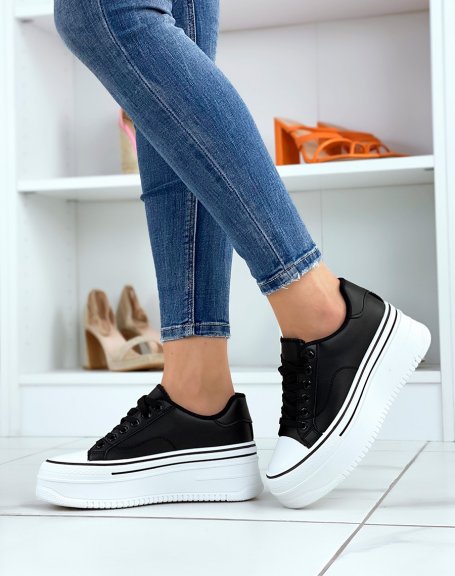 Black low-top sneakers with thick sole and black edging