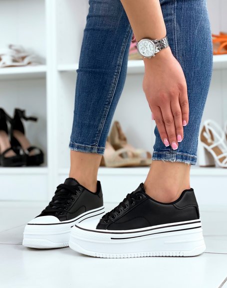 Black low-top sneakers with thick sole and black edging