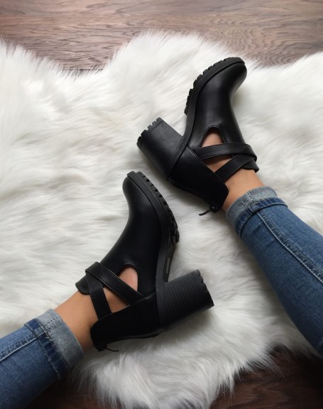 Black lugged ankle boots with crossed buckles