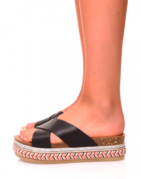 Black mules with double crossed straps and braided soles