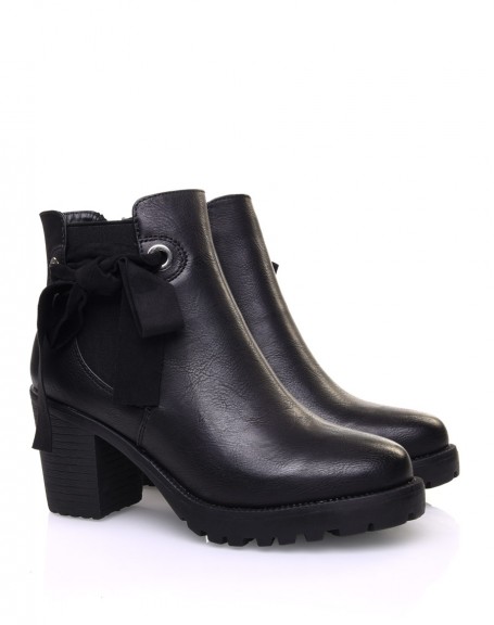 Black notched ankle boots with knots and eyelets