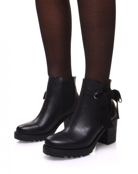 Black notched ankle boots with knots and eyelets