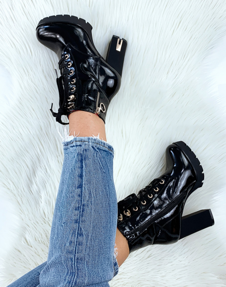 Black patent ankle boots with gold eyelets