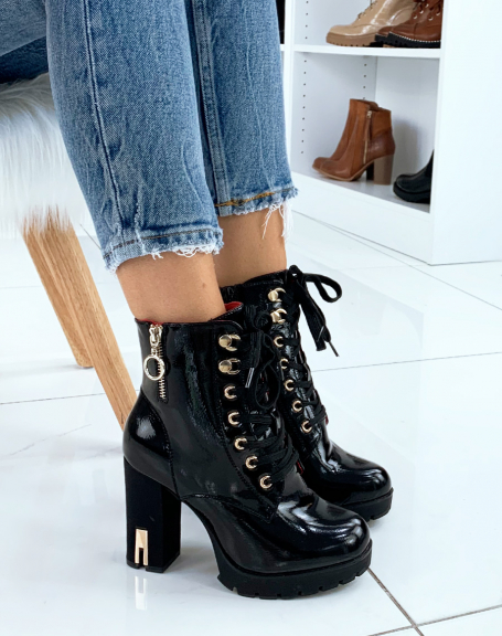 Black patent ankle boots with gold eyelets