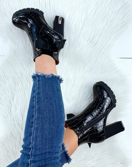 Black patent croc-effect heeled ankle boots adorned with a bow
