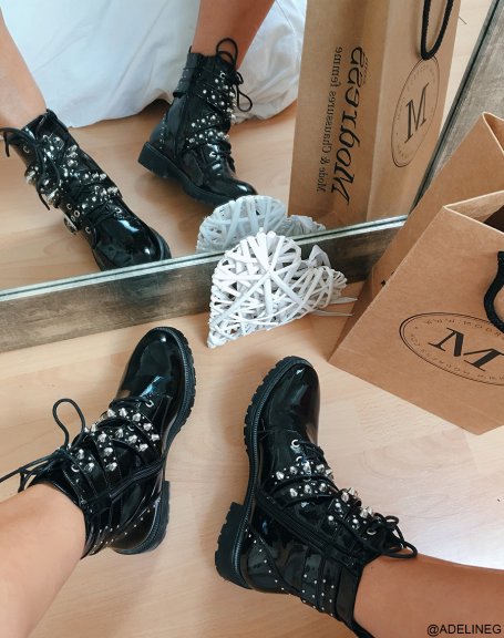 Black patent high-top ankle boots with laces and multiple straps