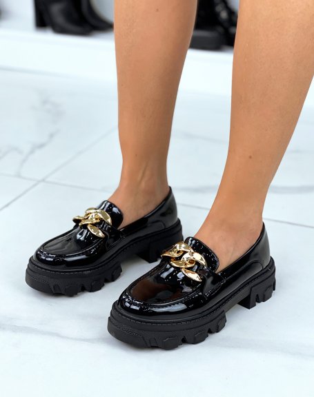 Black patent loafers with thick soles and golden chain