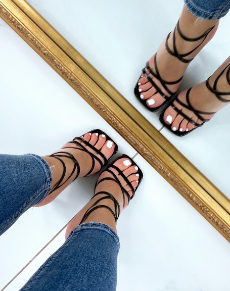 Black patent sandals with criss-cross straps and stiletto heel