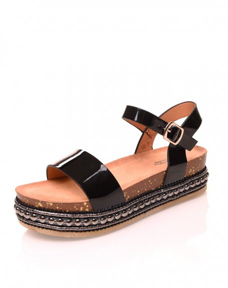 Black patent strap sandals and studded platforms