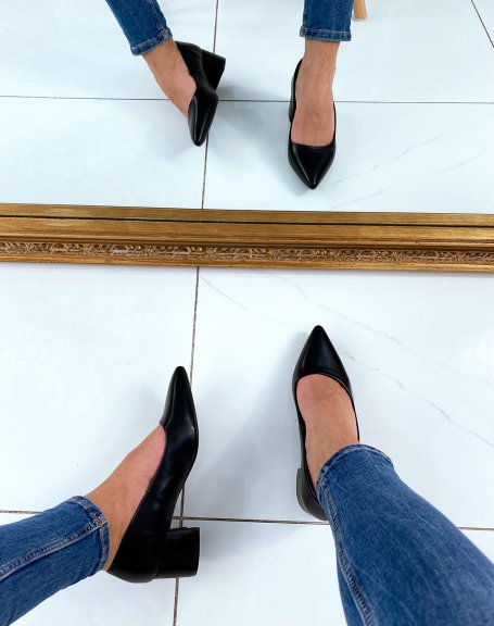 Black pumps with low heels and pointed toes