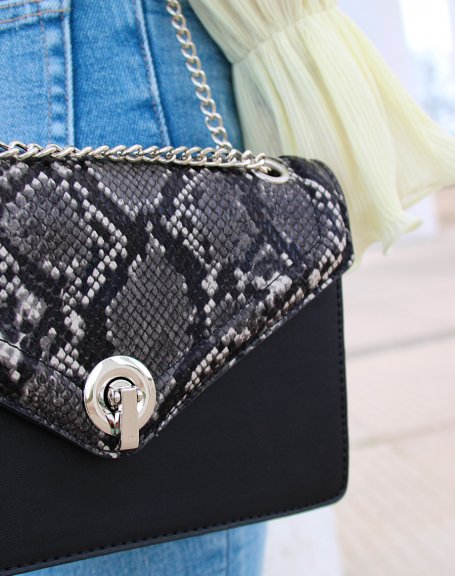 Black python-effect clutch with silver chain