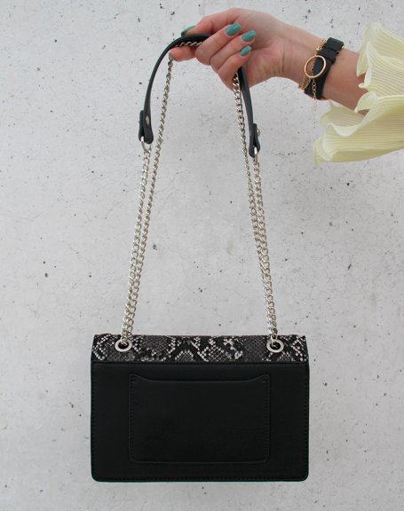 Black python-effect clutch with silver chain