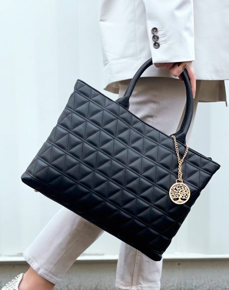 Black quilted handbag with gold pendant