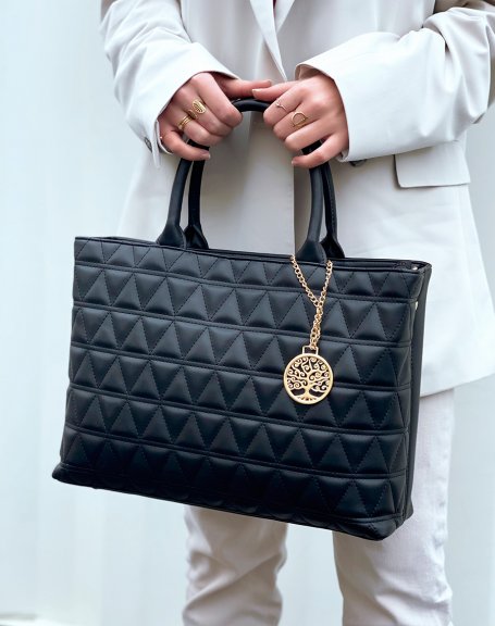 Black quilted handbag with gold pendant