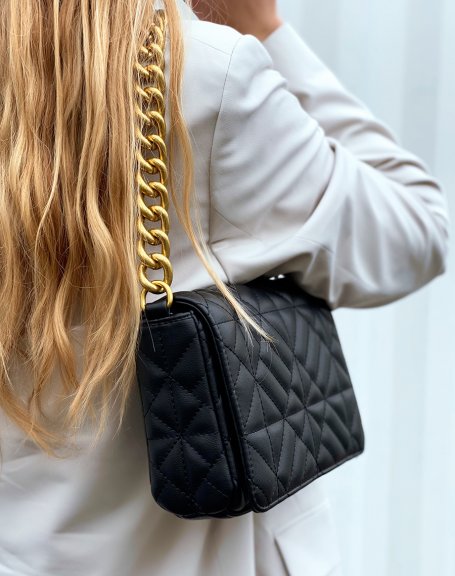Black quilted shoulder bag with large golden chain