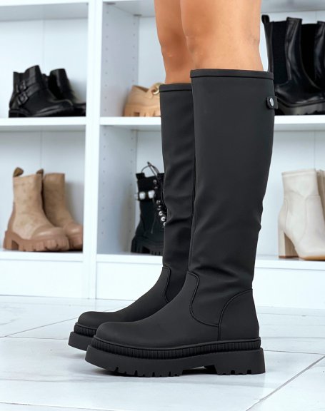 Black rubber boots with lug sole