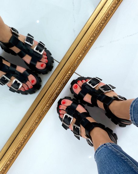 Black sandal with notched sole and multiple adjustable straps