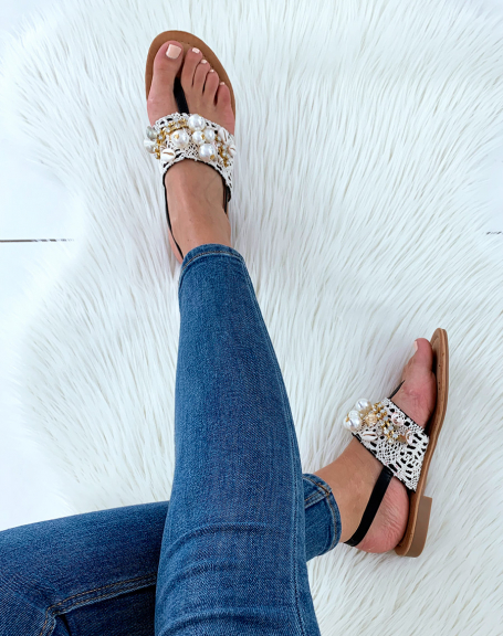 Black sandals adorned with pearl lace and rhinestones