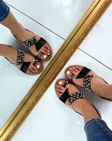 Black sandals and snake effect adorned with studs