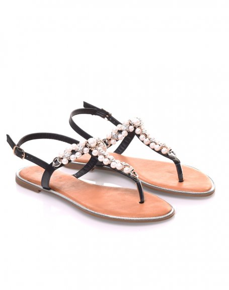 Black sandals decorated with pearls