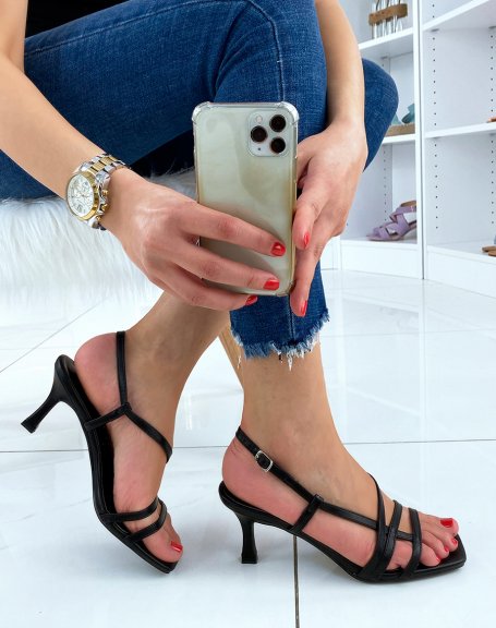 Black sandals with a small thin heel and crossed straps