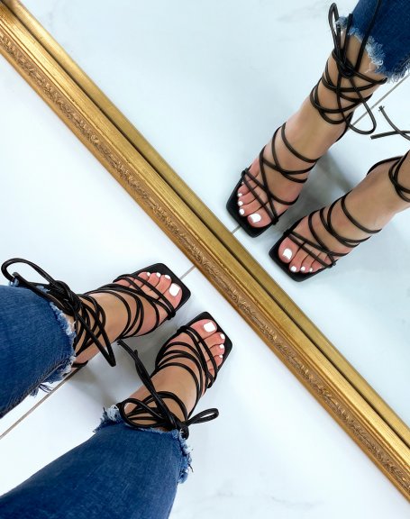 Black sandals with criss-cross laces and high block heel