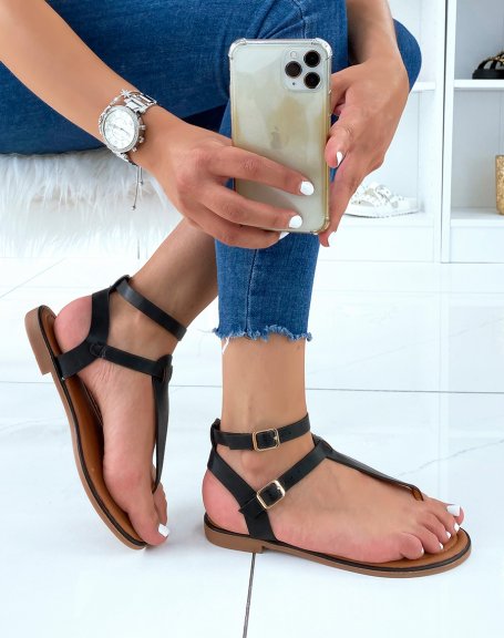 Black sandals with double strap and gold buckles