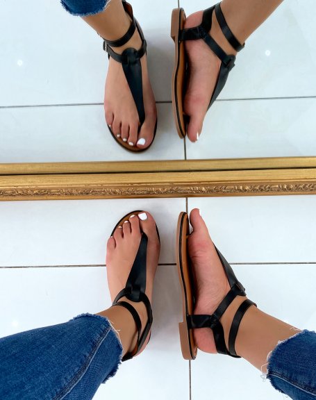 Black sandals with double strap and gold buckles