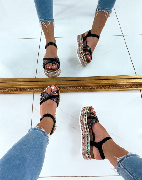 Black sandals with fancy wedge soles and multiple straps