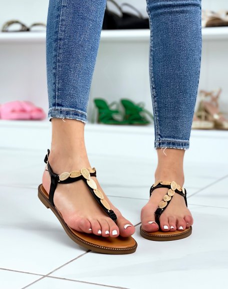 Black sandals with gold pieces and multiple straps