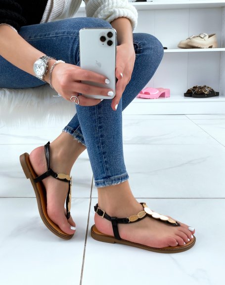 Black sandals with gold pieces and multiple straps