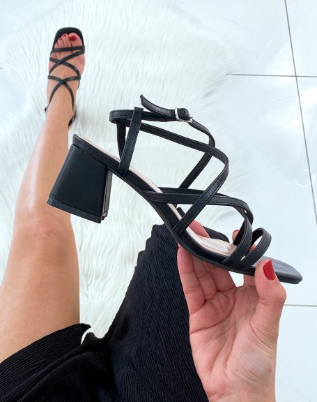 Black sandals with multiple crossed straps