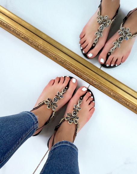 Black sandals with multiple shiny black and gold jewels