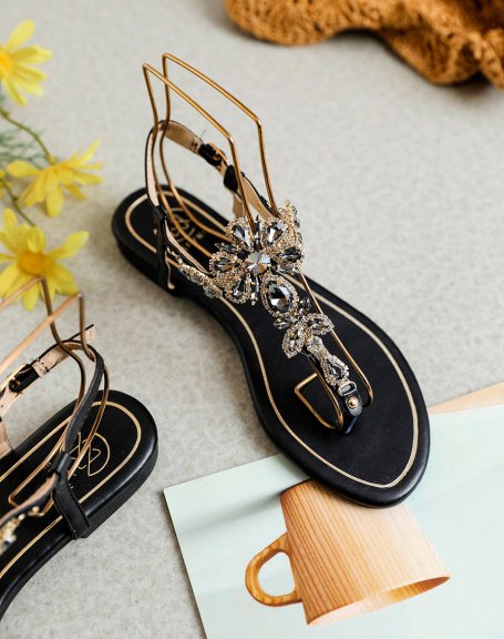 Black sandals with multiple shiny black and gold jewels
