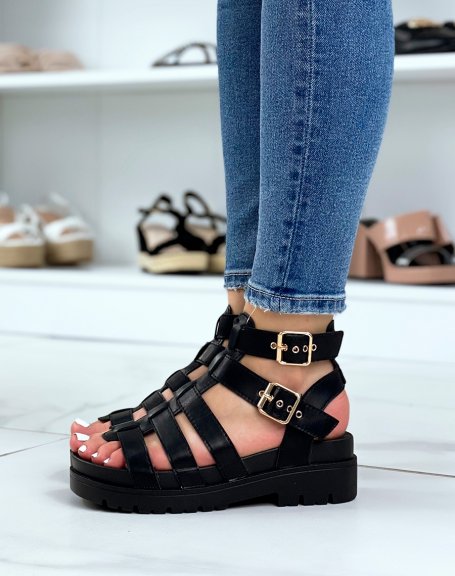 Black sandals with multiple straps and gold details