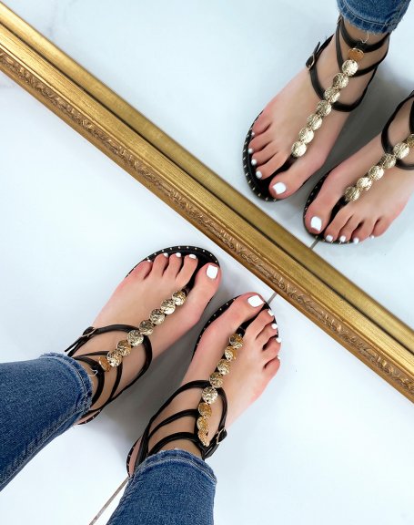 Black sandals with multiple straps and gold jewels