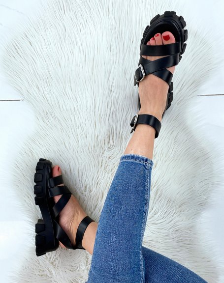 Black sandals with multiple straps and notched sole