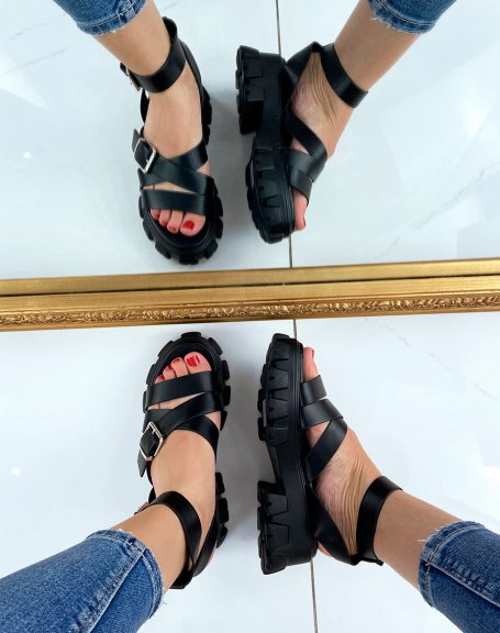 Black sandals with multiple straps and notched sole