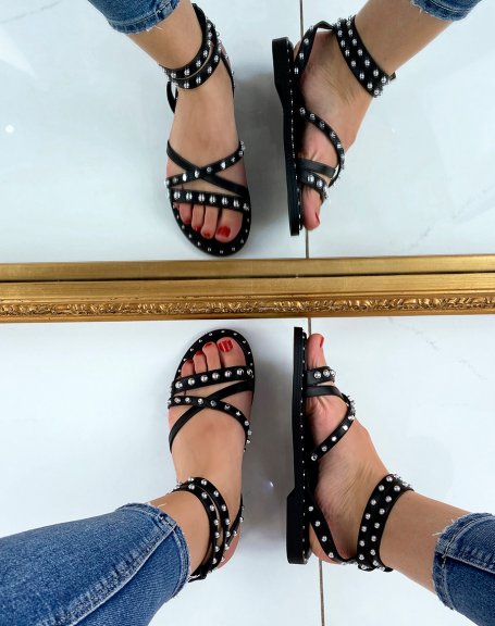 Black sandals with multiple studded crisscross straps
