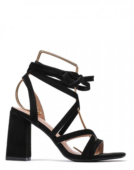 Black sandals with narrow straps crossed with lace and heel