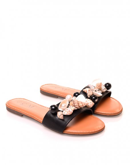 Black sandals with pearl and shell details