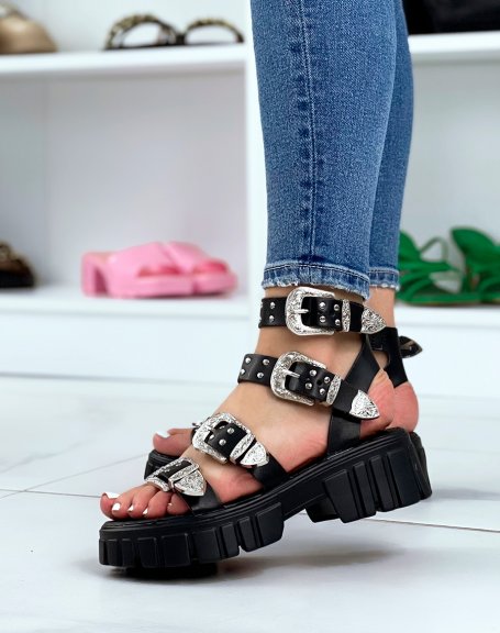 Black sandals with small heel and multiple straps and silver details