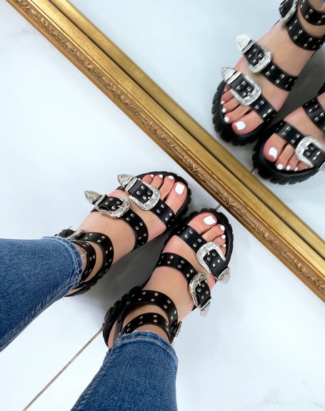 Black sandals with small heel and multiple straps and silver details