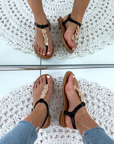 Black sandals with stamped gold jewels